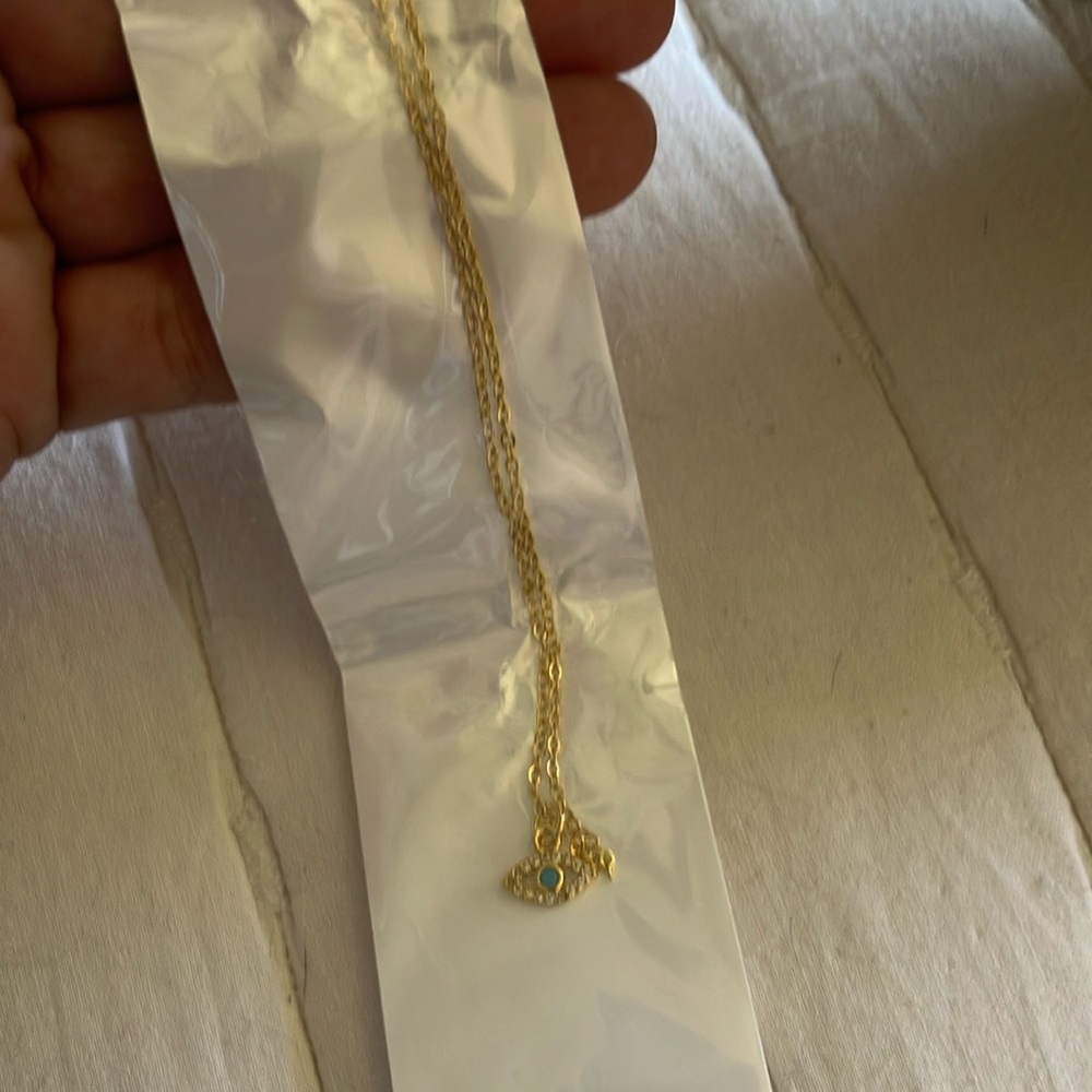 Gold Pendant Necklace with Blue Accent